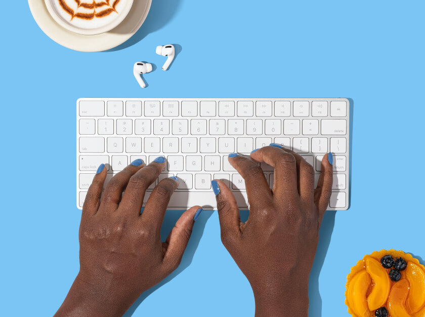 Closeup of someone typing on a keyboard