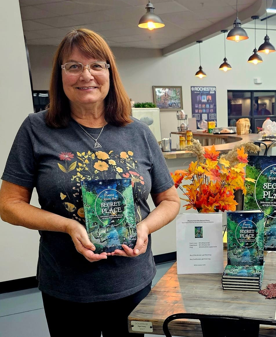 Author holding her poetry book
