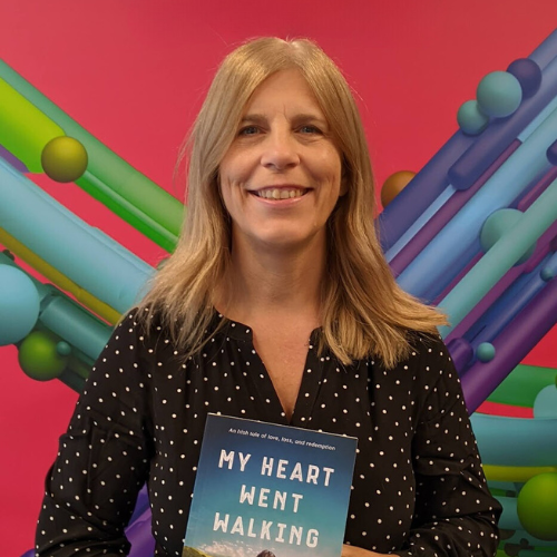 Author Sally Hanan holding her debut novel