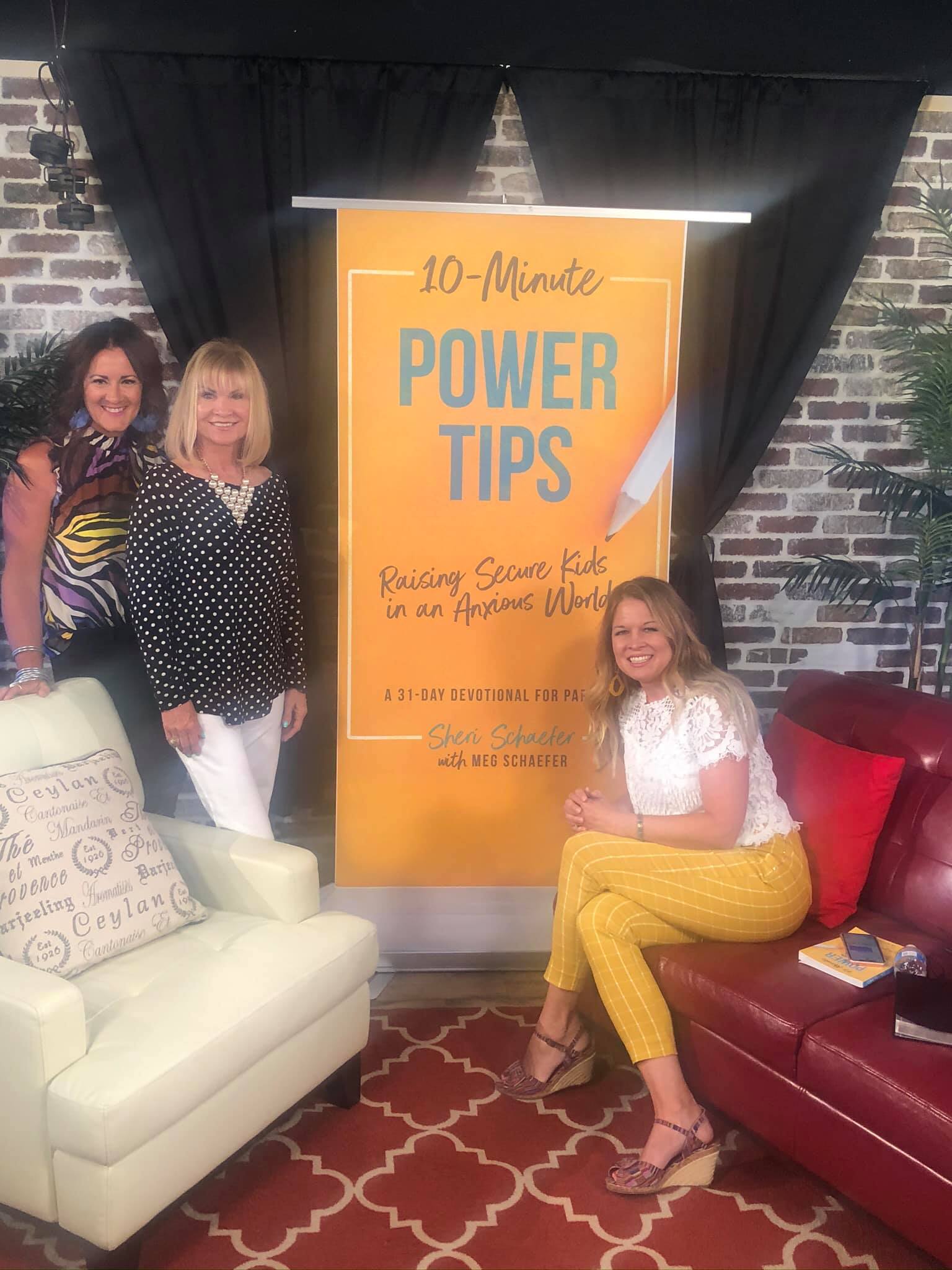 Author Sheri Schaefer holding her book